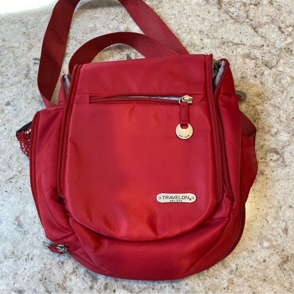Red traveling bag. New. So many pockets!
